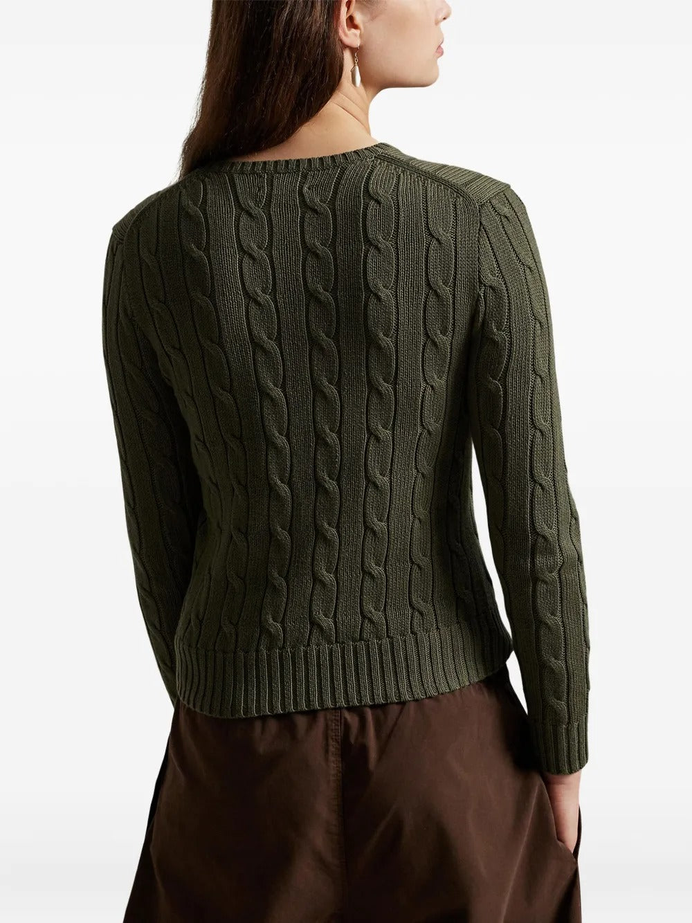 Green pullover worn by a person, showing the pullover's fit