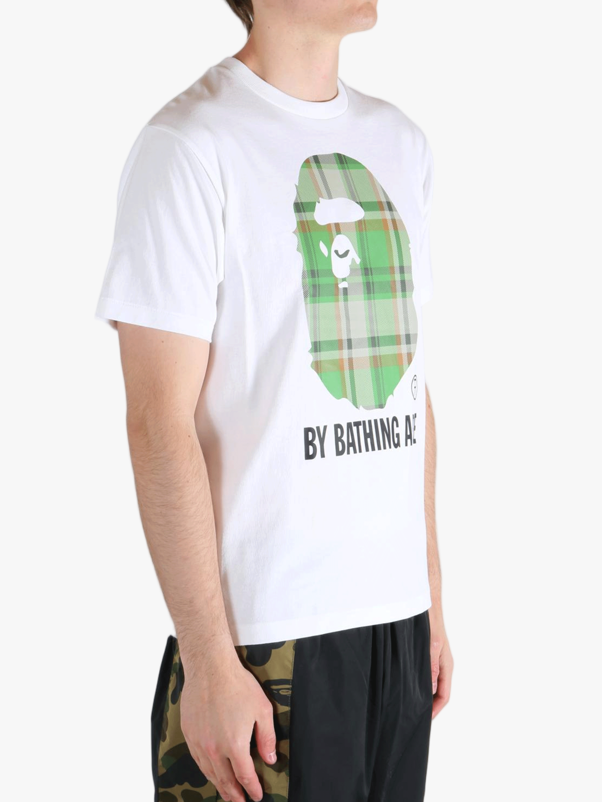 White t-shirt worn by a person, showing the t-shirt's fit