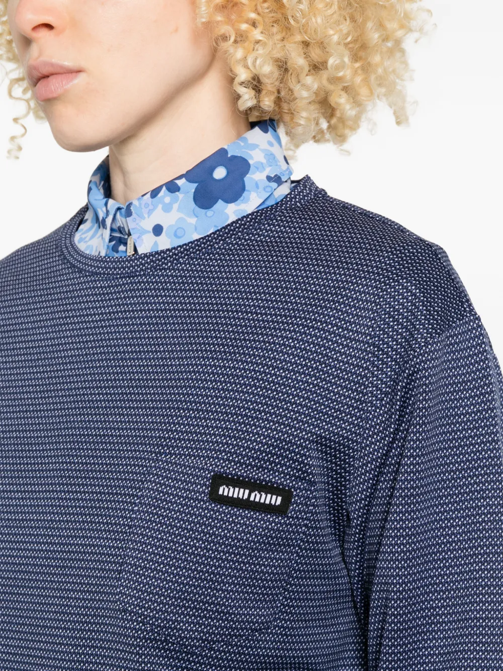 Close up of blue sweater,showing texture of the cotton fabric