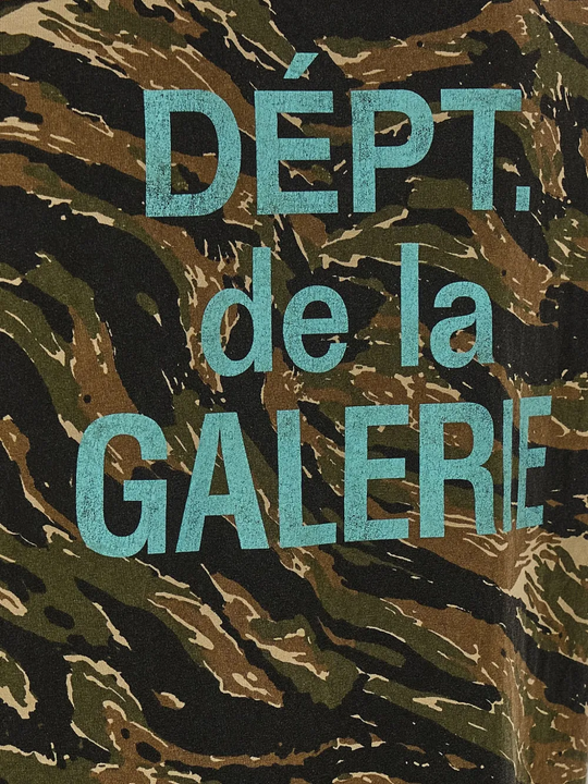 Close up of green t-shirts, showing texture of the cotton fabric