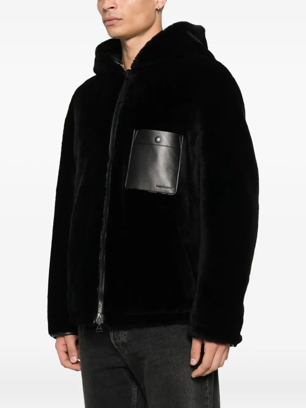 Black jacket worn by a person, showing the jacket's fit