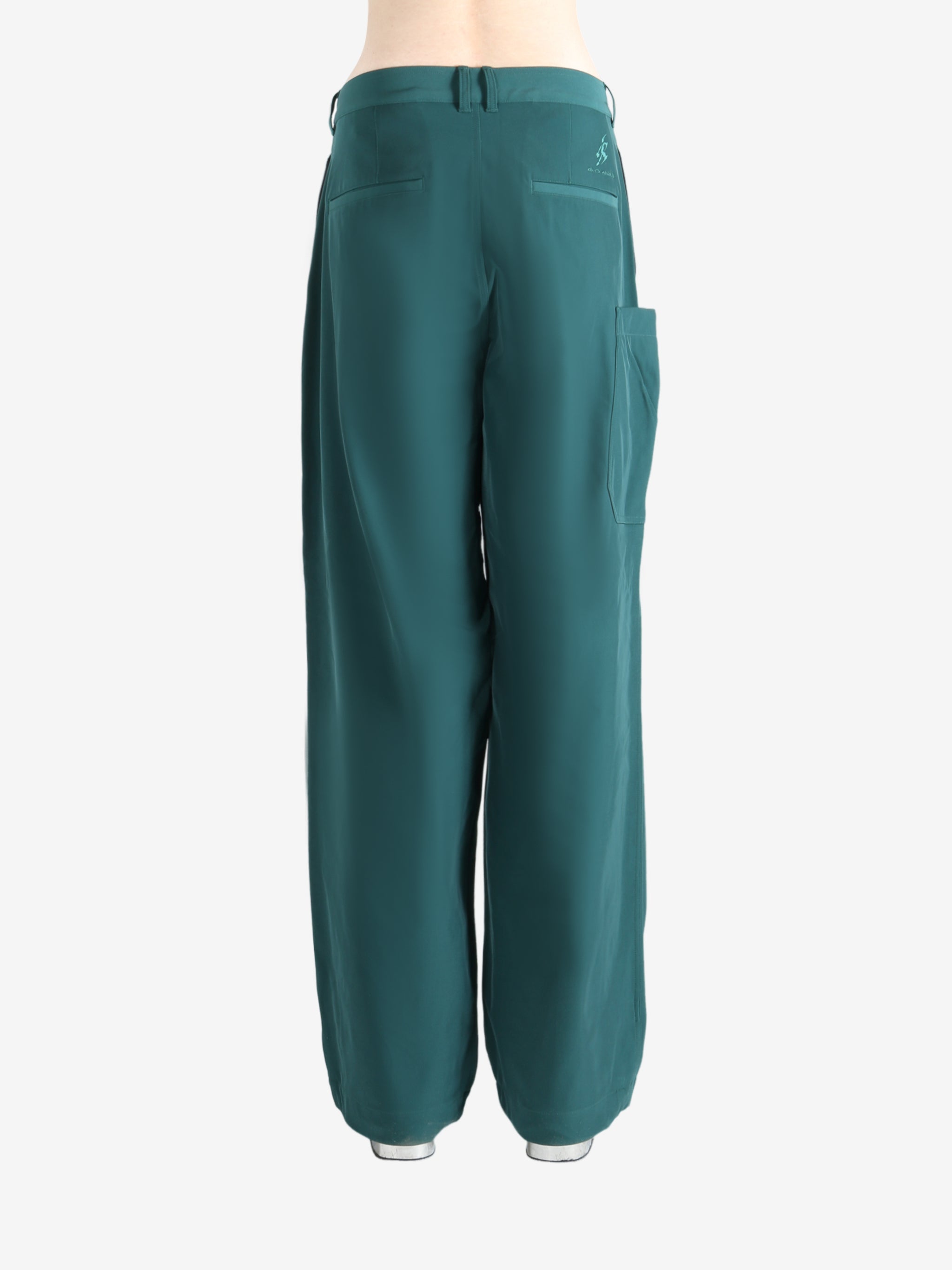 Blue pants worn by a person, showing the pants' fit