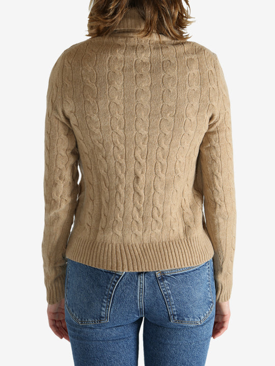 Tan pullover worn by a person, showing the pullover's fit