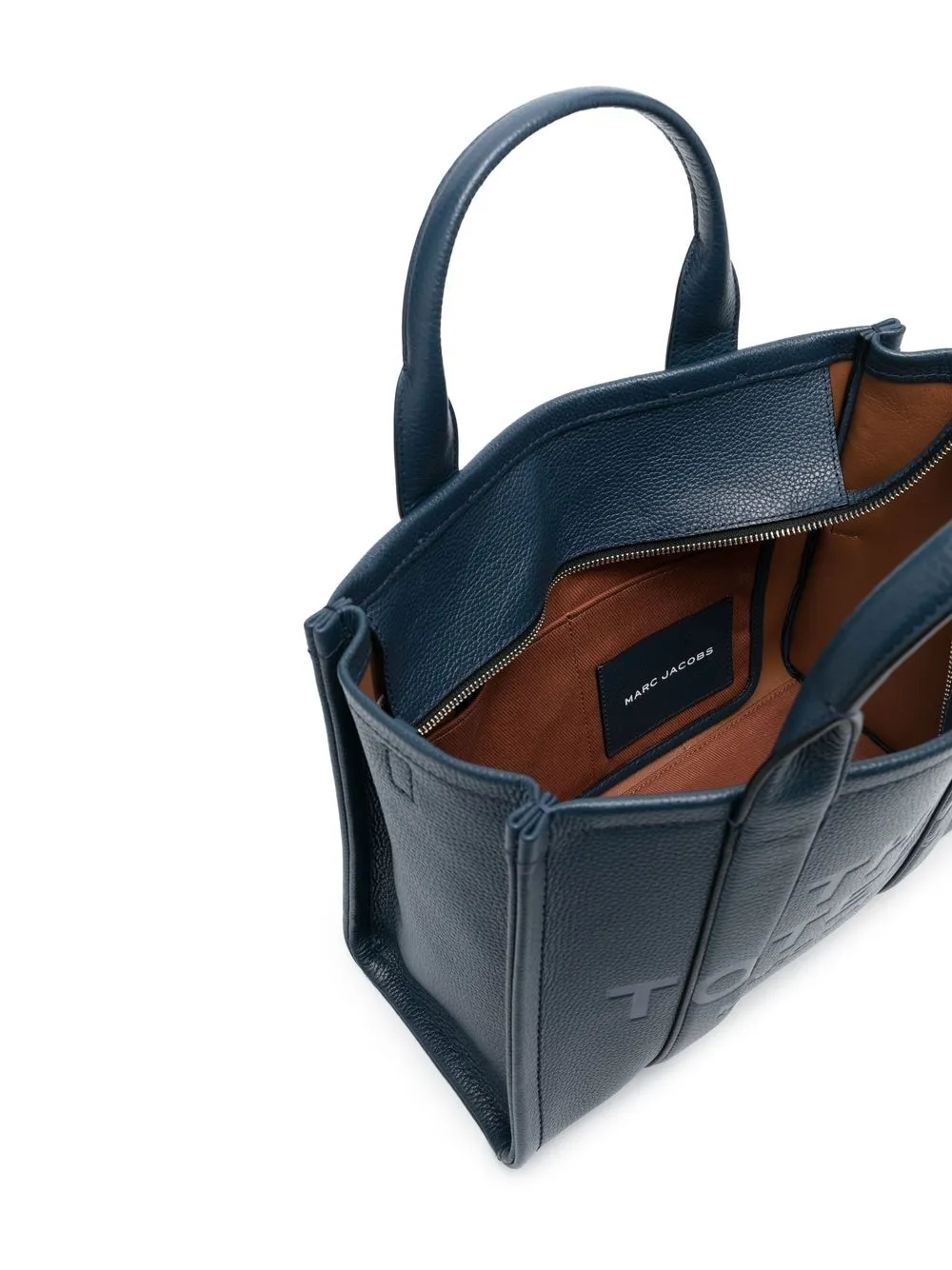 Close up of navy bags, showing texture of the leather fabric