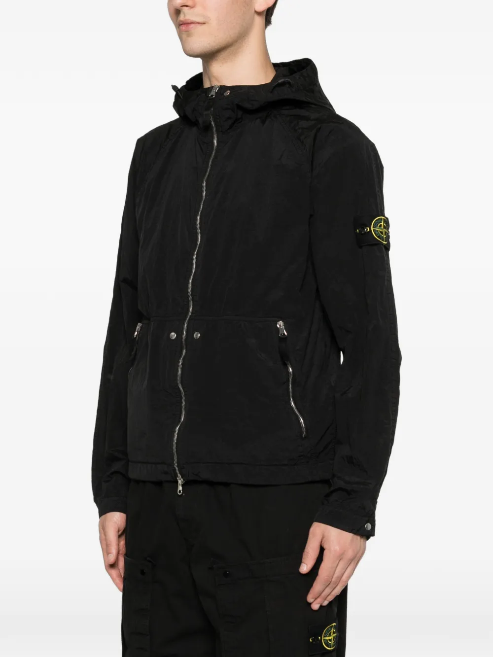 Black parka worn by a person, showing the parka's fit