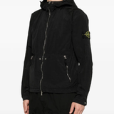 Black parka worn by a person, showing the parka's fit