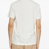 White t-shirt worn by a person, showing the t-shirt's fit