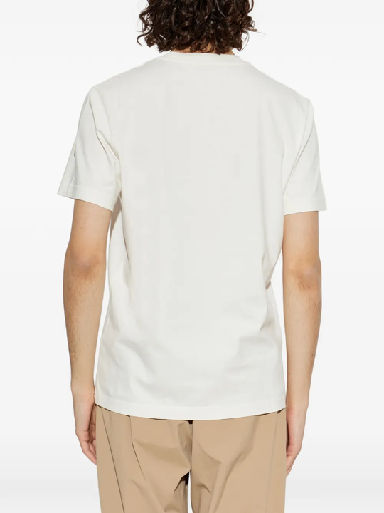 White t-shirt worn by a person, showing the t-shirt's fit