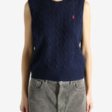 Navy sweater worn by a person, showing the sweater's fit