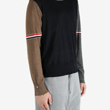 Blue knitwear worn by a person, showing the knitwear fit