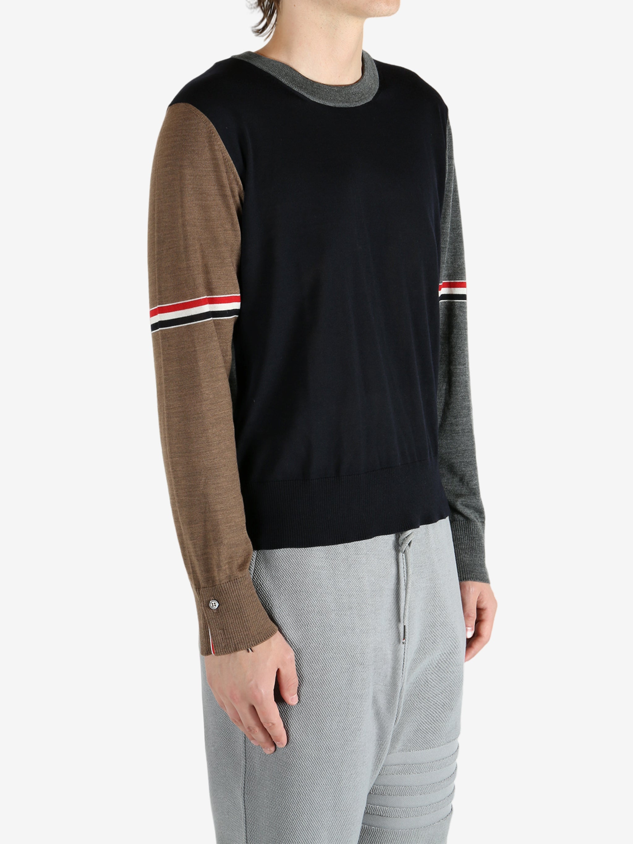 Blue knitwear worn by a person, showing the knitwear fit