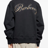 Black sweats worn by a person, showing the sweats' fit