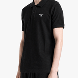 Black top worn by a person, showing the top fit