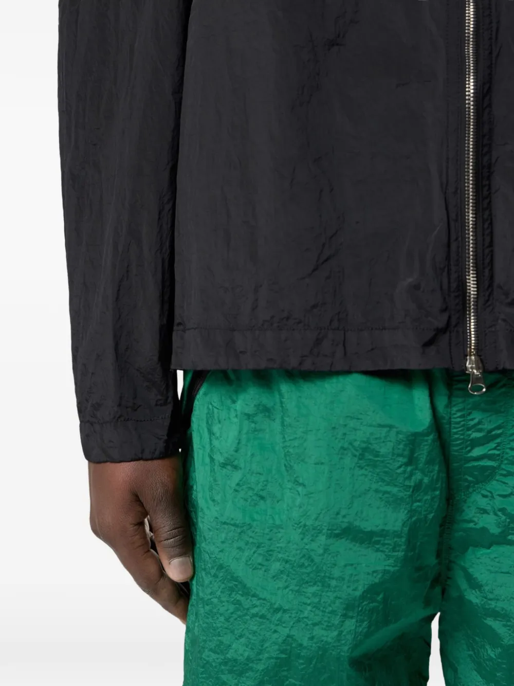 Close up of the black jacket, showing texture of the polyamide fabric