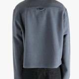 Blue jacket worn by a person, showing the jacket's fit