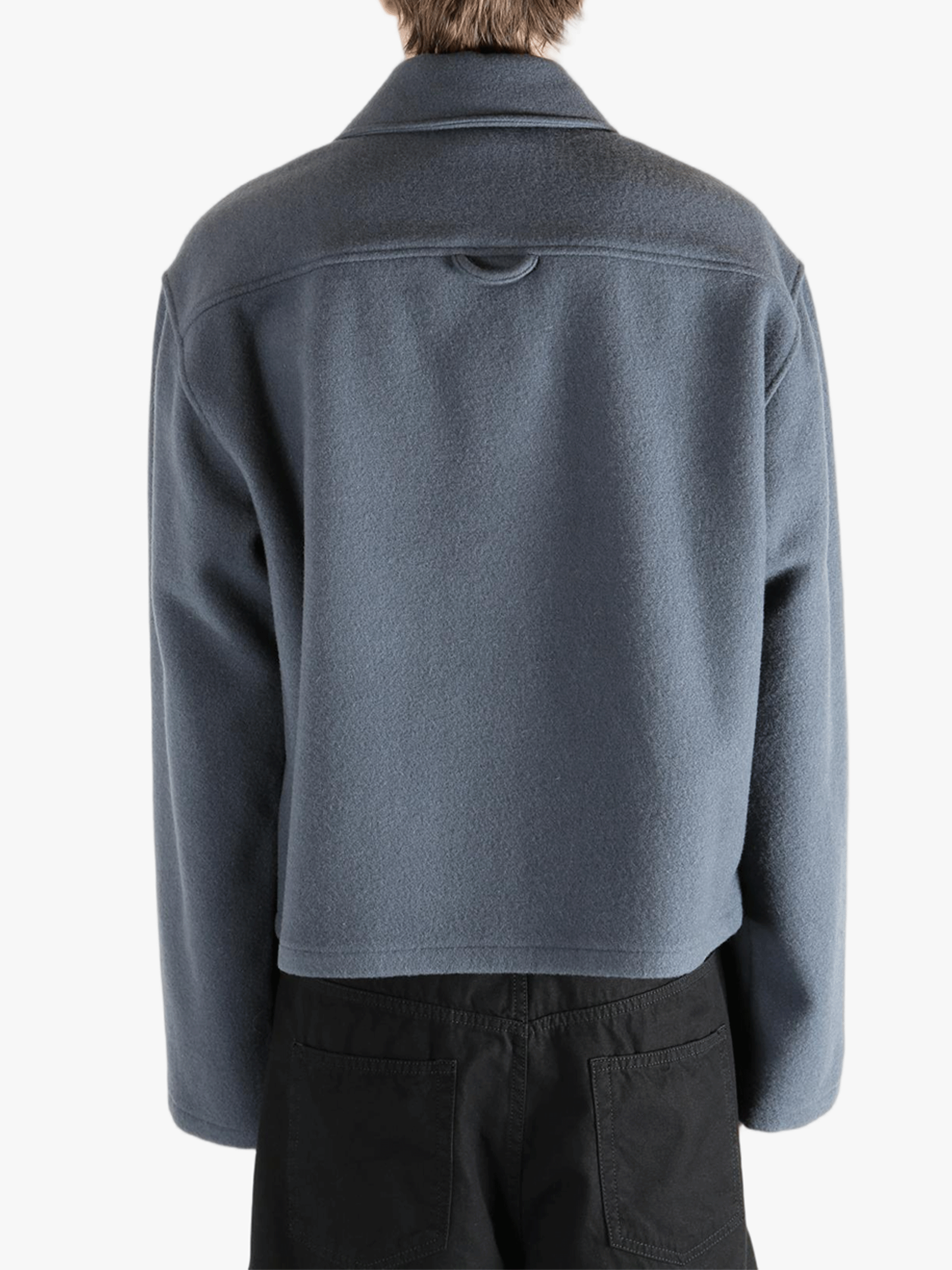 Blue jacket worn by a person, showing the jacket's fit