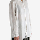 White shirt worn by a person, showing the shirt's fit