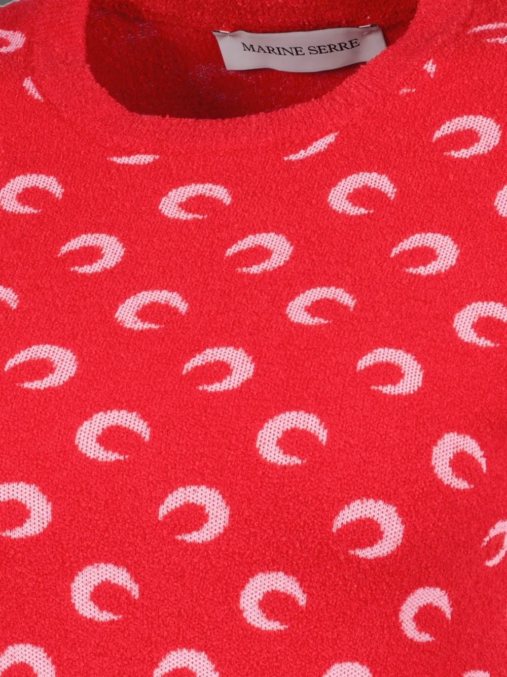Close up of Red top, showing texture of the 53% cotton/ 30% polyamide/ 17% viscose fabric