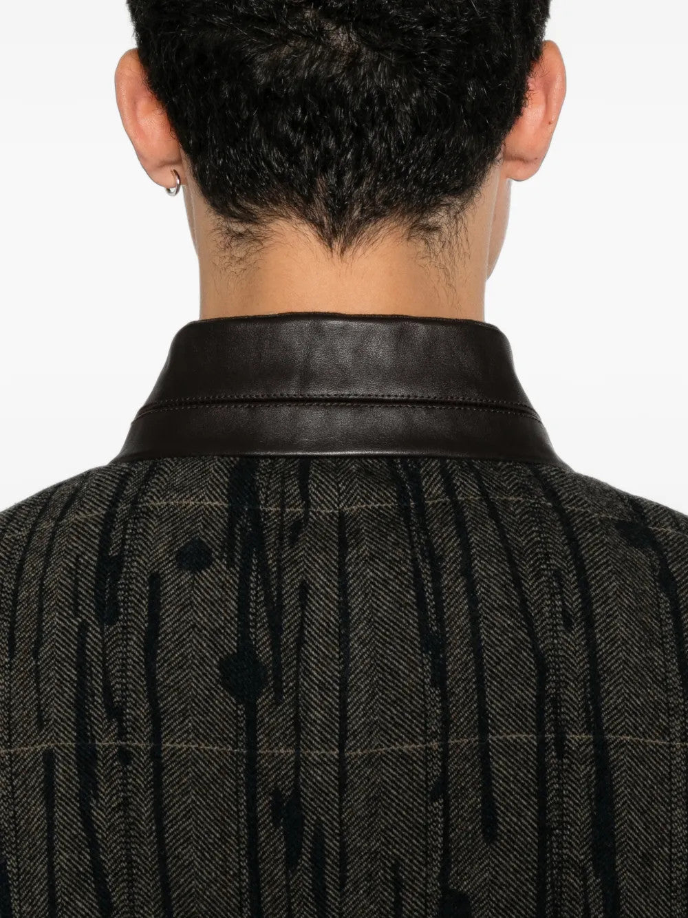 Grey blazer worn by a person, showing the blazer fit