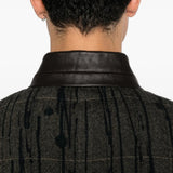 Grey blazer worn by a person, showing the blazer fit