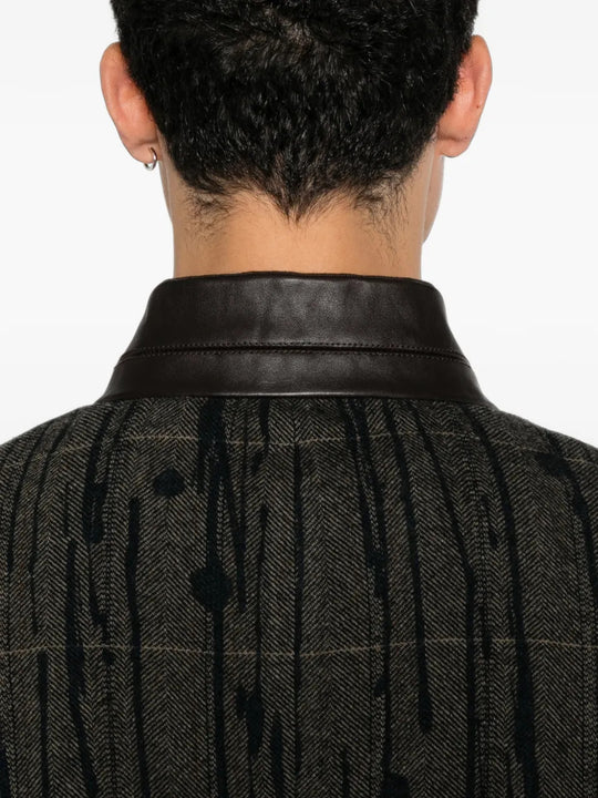 Grey blazer worn by a person, showing the blazer fit