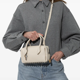 tan bag worn by a person, showing the bag fit