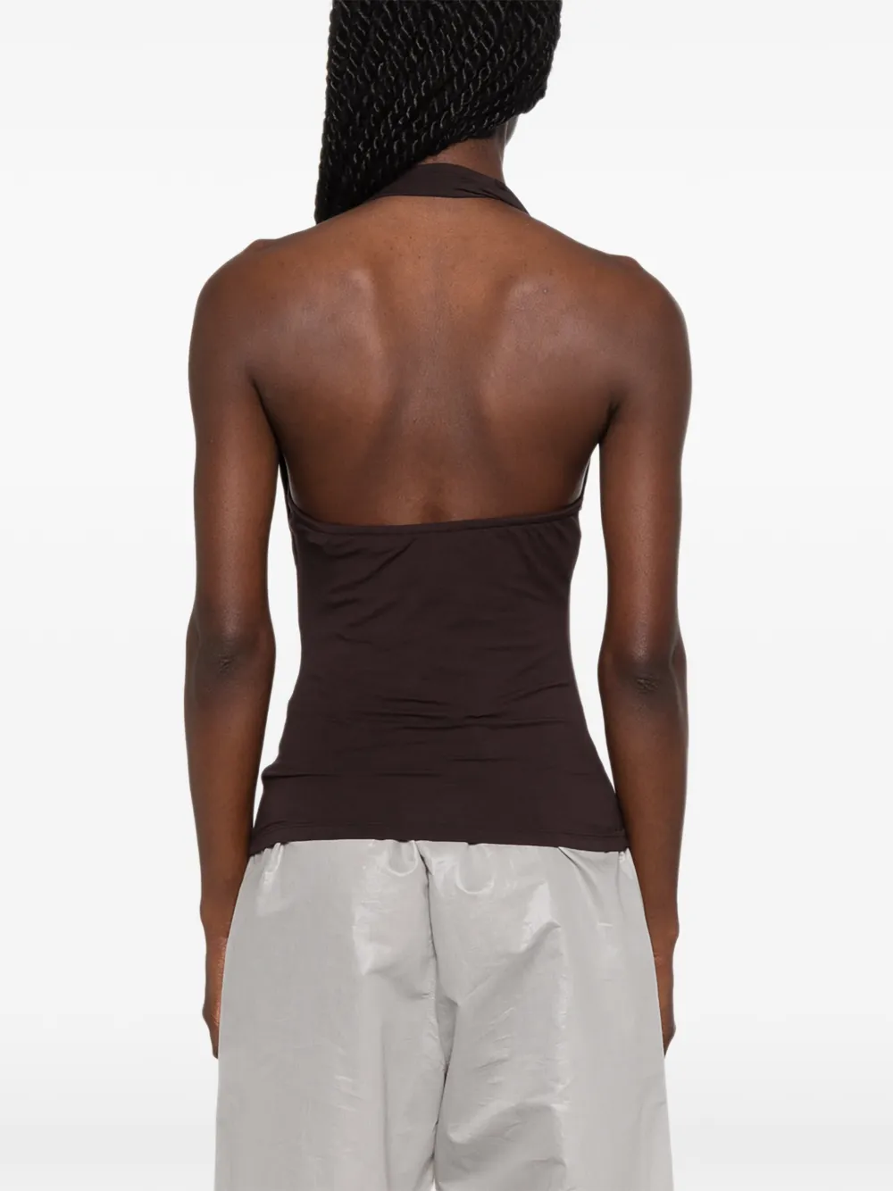 Brown top worn by a person, showing the top's fit