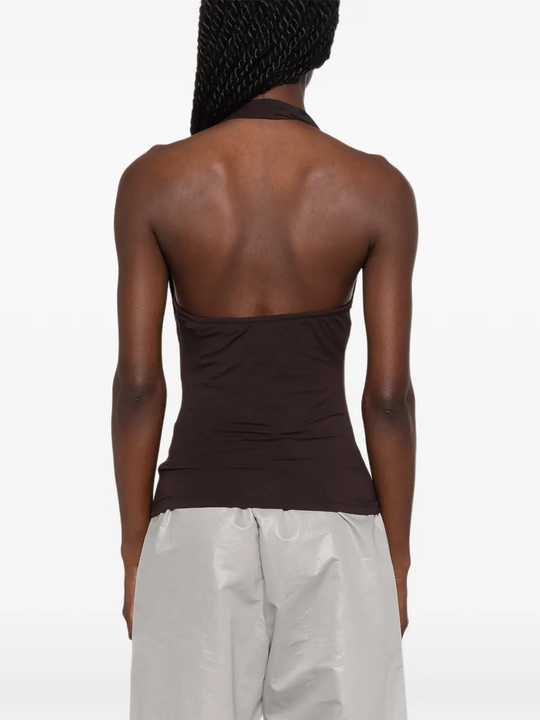 Brown top worn by a person, showing the top's fit
