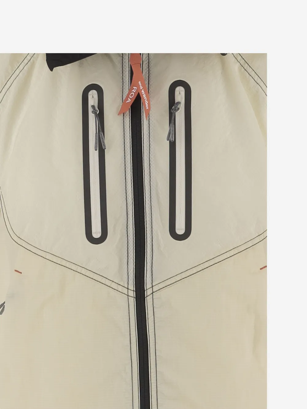 Close up of white jacket-coat, showing texture of the nylon fabric