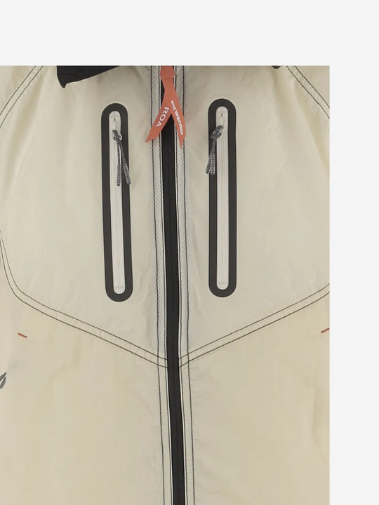 Close up of white jacket-coat, showing texture of the nylon fabric