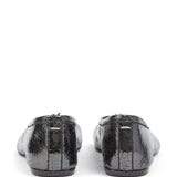 Black flats, back view