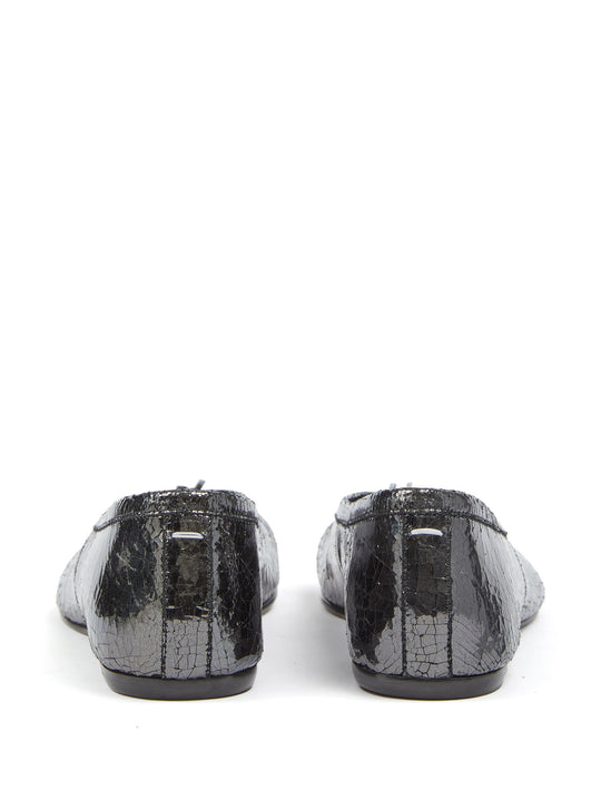 Black flats, back view