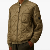 Close up of brown top,showing texture of the cotton fabric.