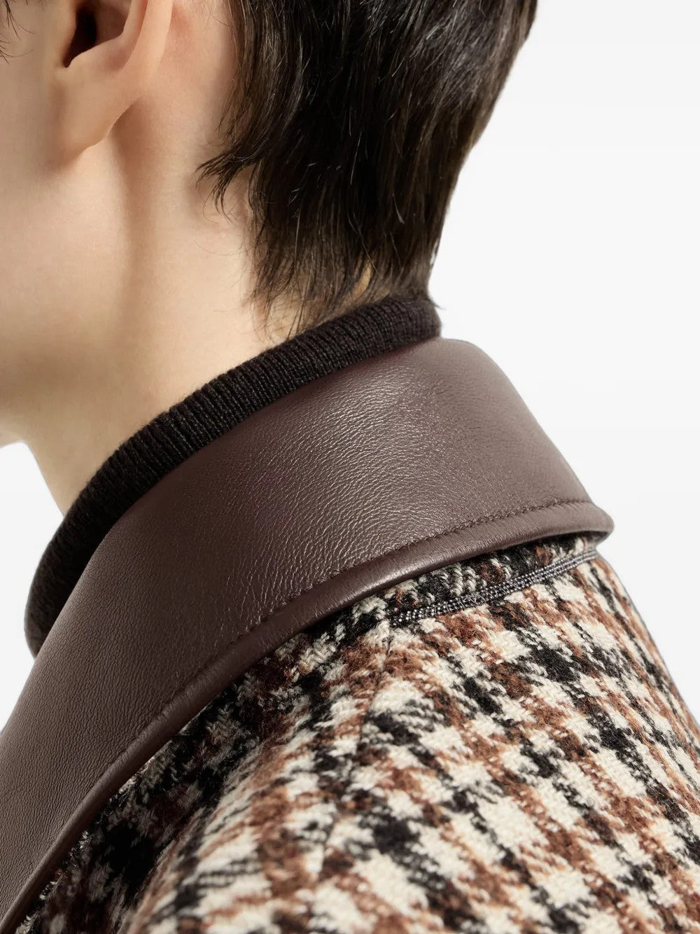 Brown jacket worn by a person, showing the jacket fit