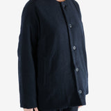 Black jacket worn by a person, showing the jacket fit