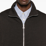 Close up of brown jackets, showing texture of the cotton and polyester and wool and polyamide fabric