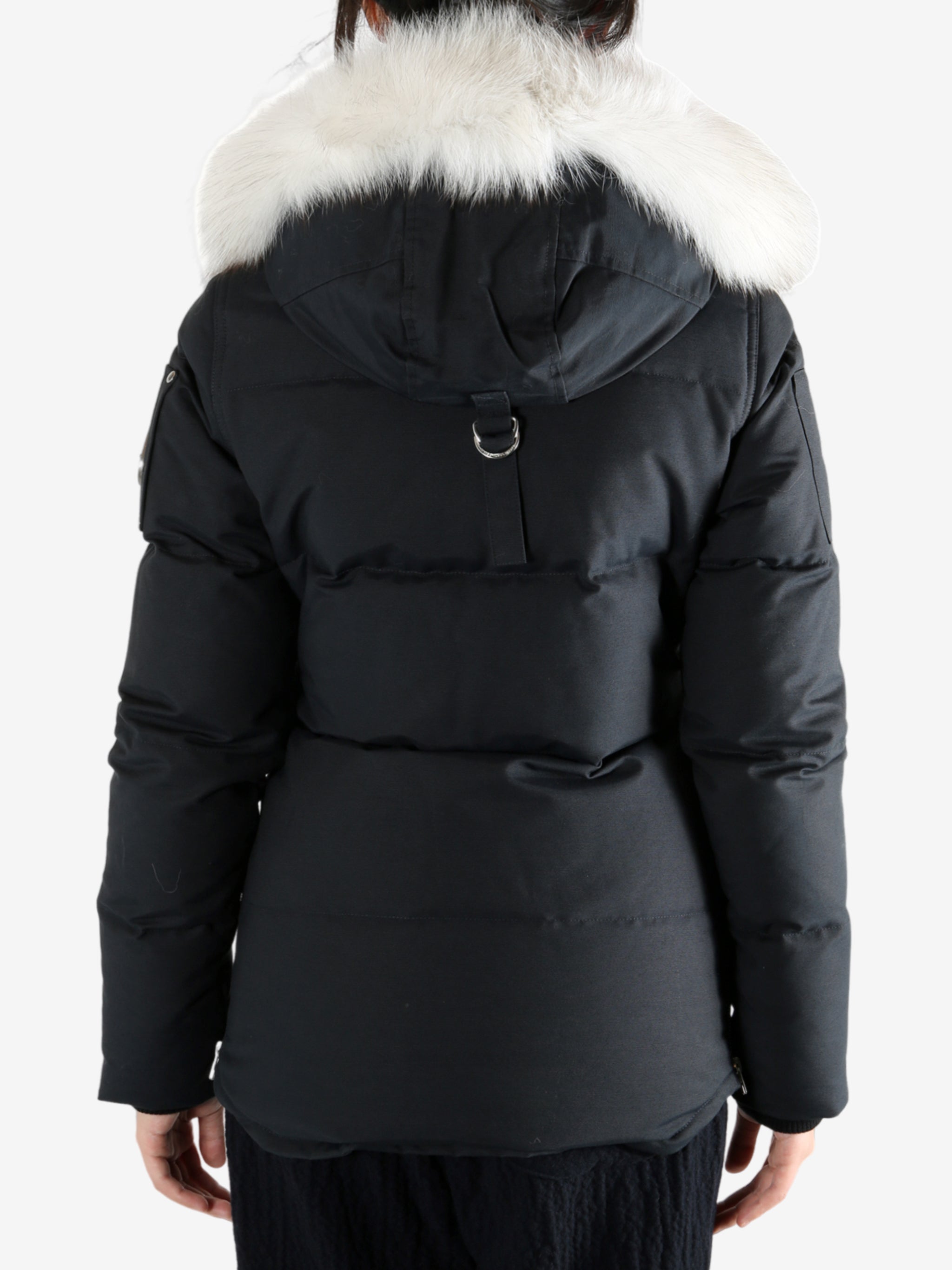 Black jackets worn by a person, showing the jackets fit