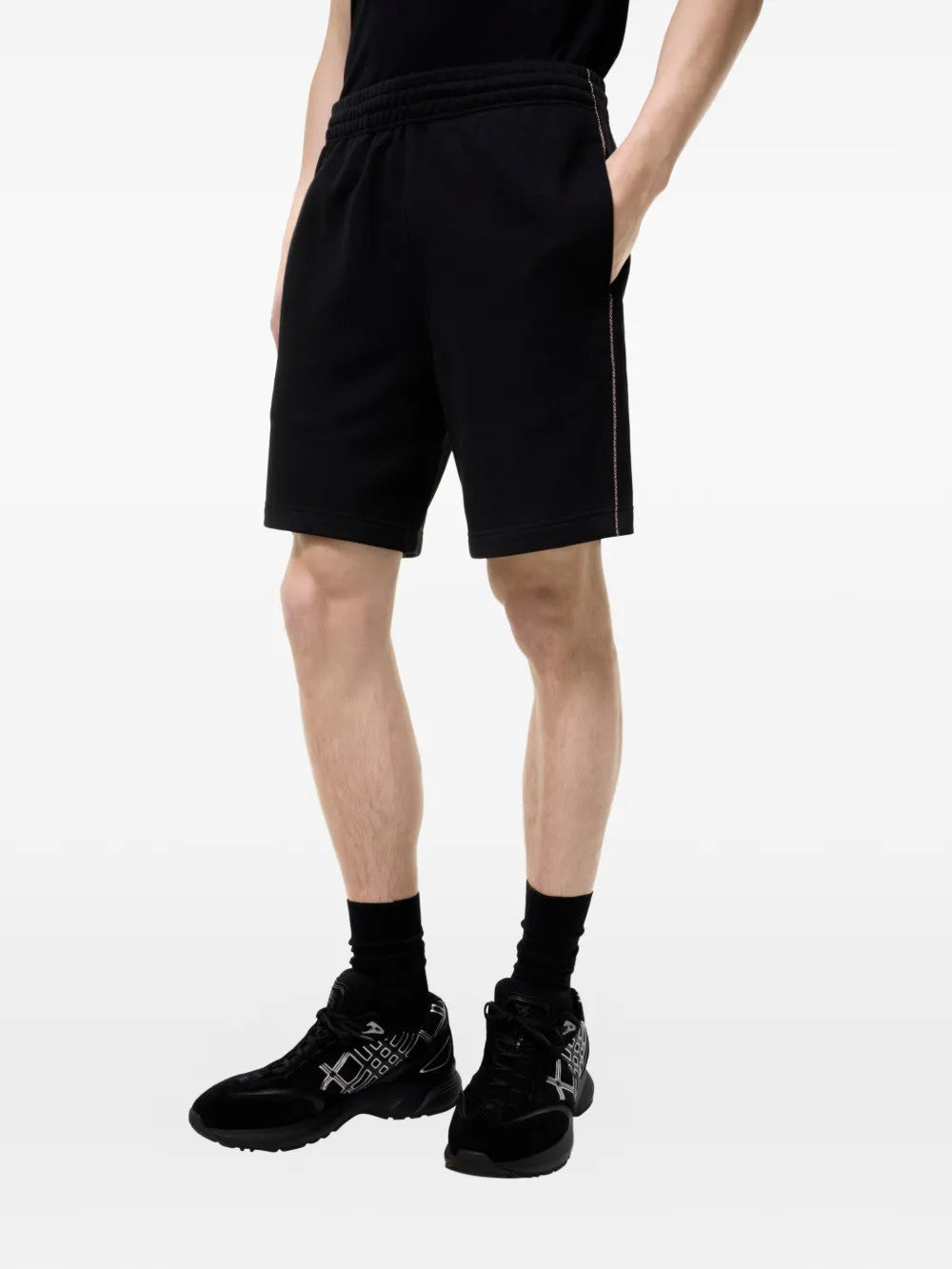 Black shorts worn by a person, showing the shorts fit