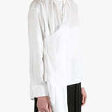 White shirt worn by a person, showing the shirt fit