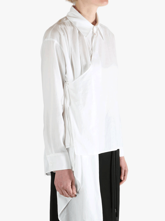 White shirt worn by a person, showing the shirt fit