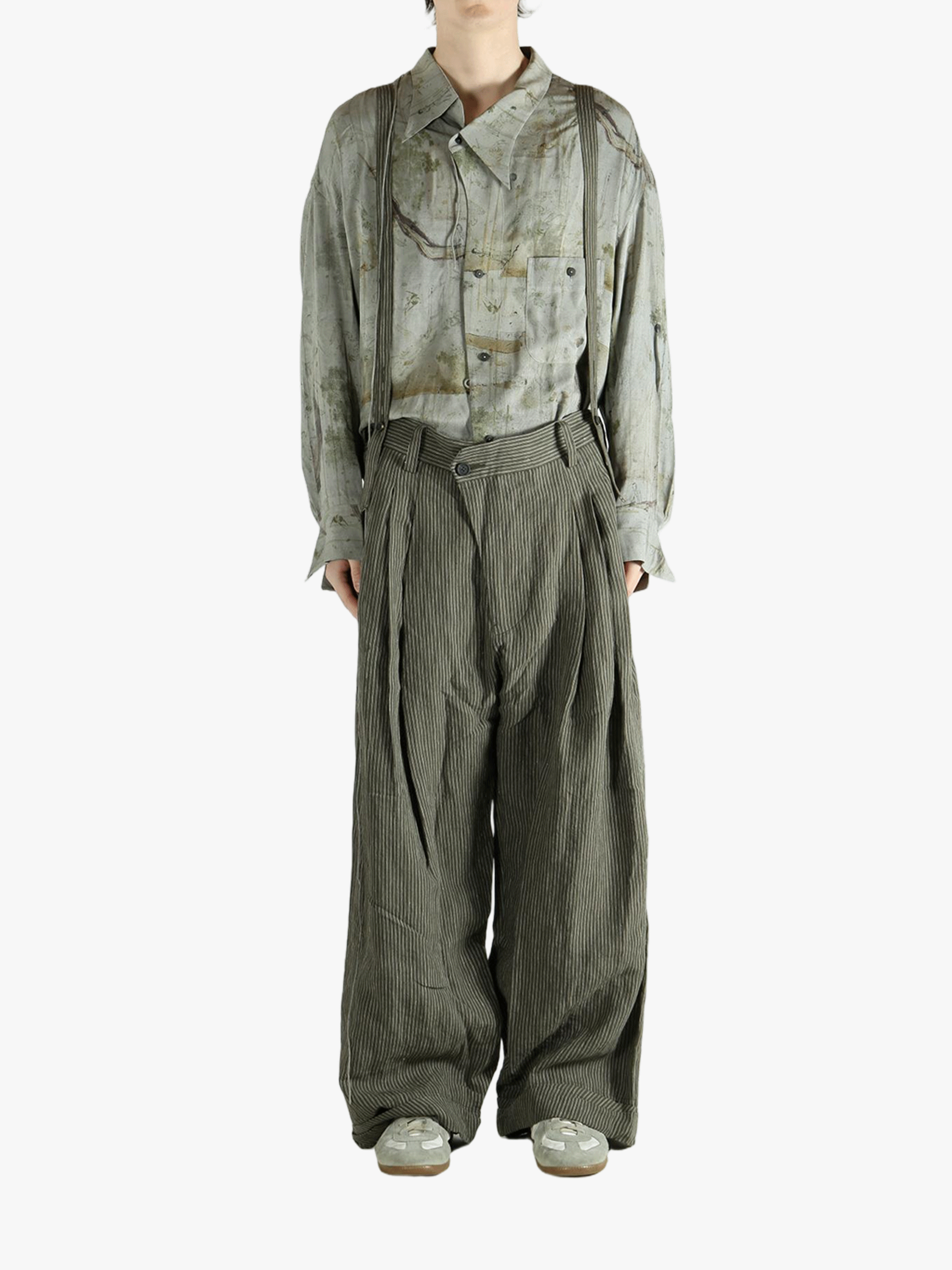 Green pants worn by a person, showing the pants's fit
