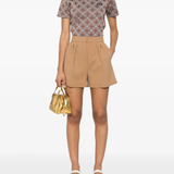 Brown shirt worn by a person, showing the shirt's fit