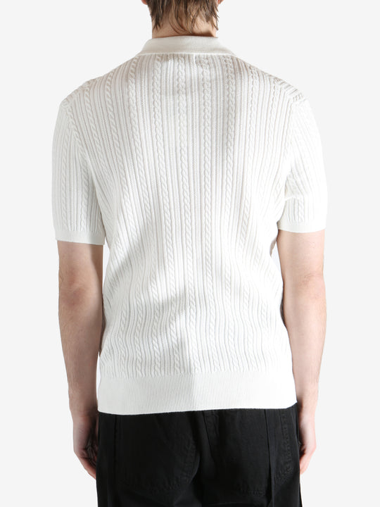 White shirt worn by a person, showing the shirt's fit