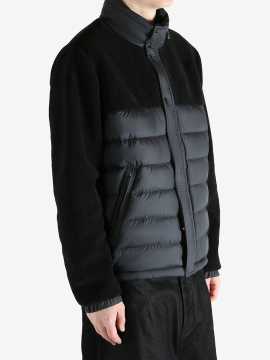 Black jackets worn by a person, showing the jackets fit