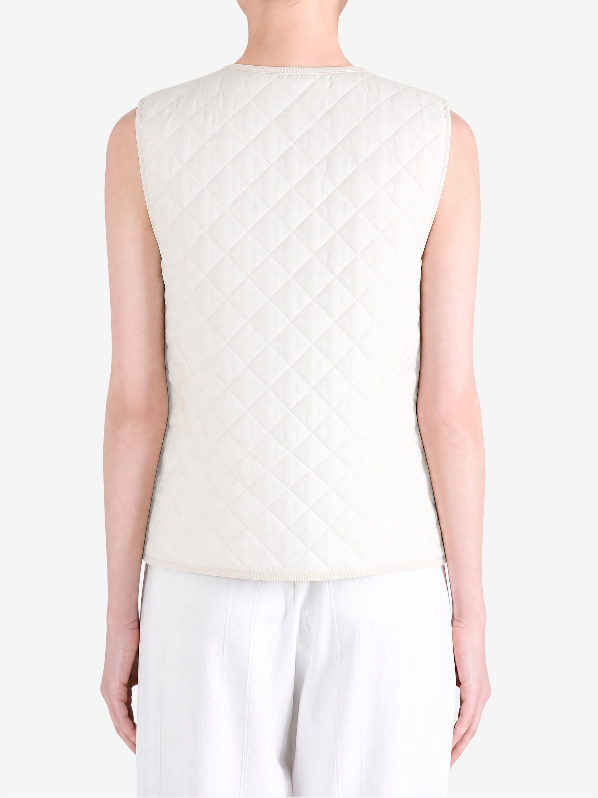 Tan top worn by a person, showing the top fit