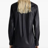 Black shirt worn by a person, showing the shirt's fit
