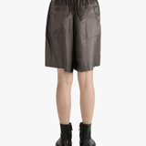 Brown shorts worn by a person, showing the shorts fit