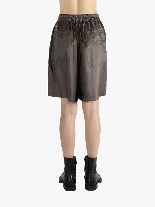 Brown shorts worn by a person, showing the shorts fit