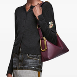 Red bag worn by a person, showing the bag fit