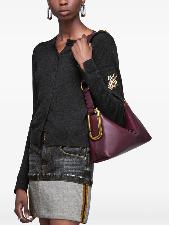 Red bag worn by a person, showing the bag fit